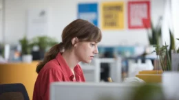 Manager reading an occupational health report after a sickness absence assessment in Bristol.